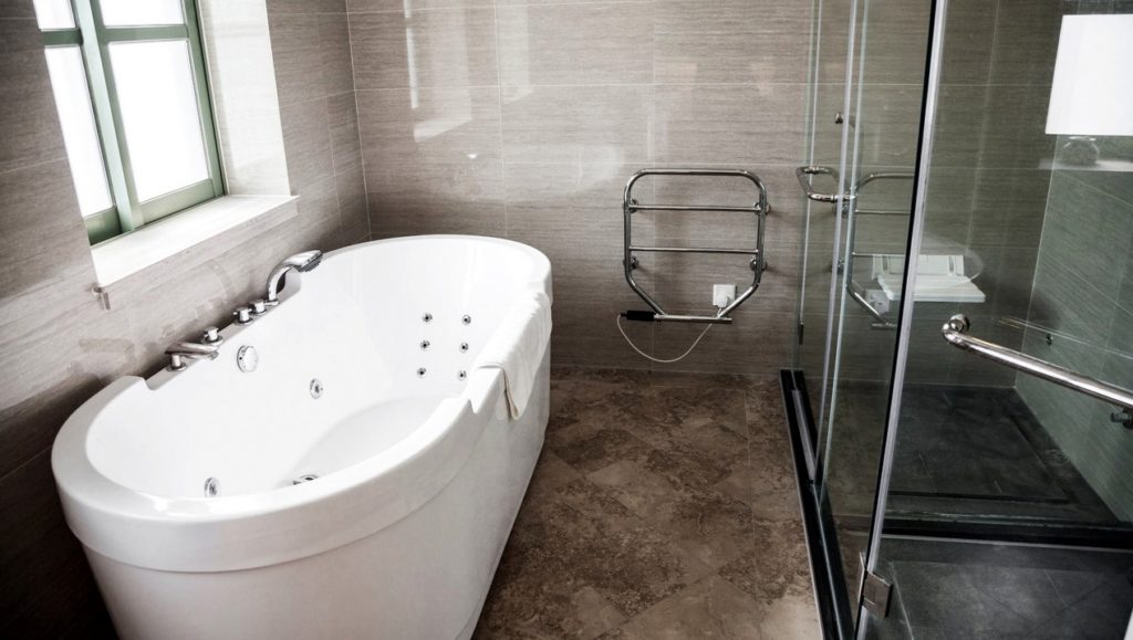 Modern clean bathroom with bathtub and shower. huasourcing