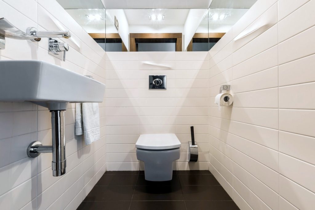 Minimalist bathroom with toilet and sink huasourcing